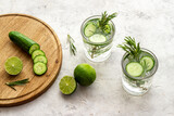 Lemonade with cucumber lime and herbs in glasses
