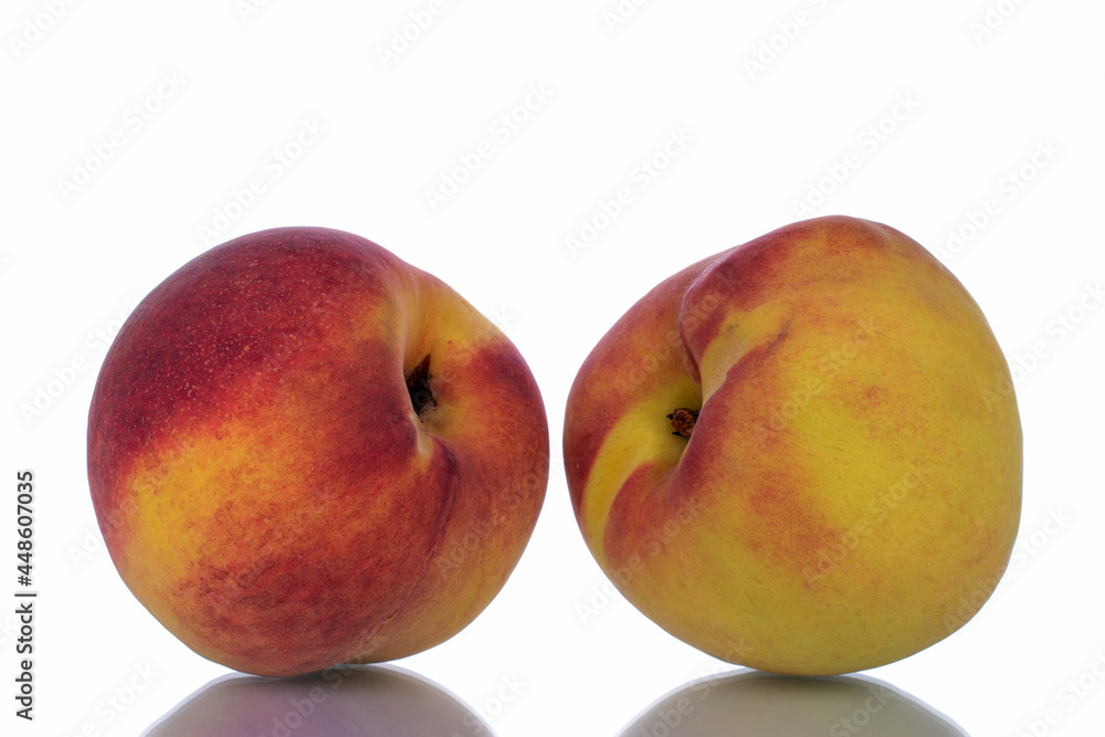 Two ripe peaches, close-up, isolated on white. Two ripe peaches, close-up, isolated on white.