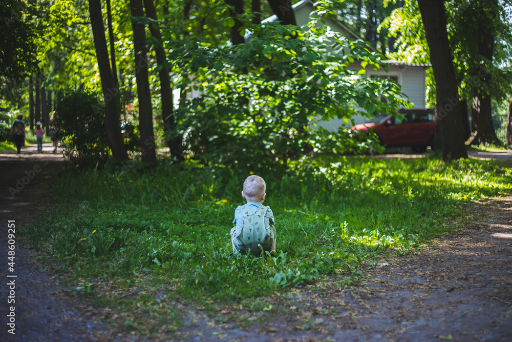 Fototapeta premium Child in green grass