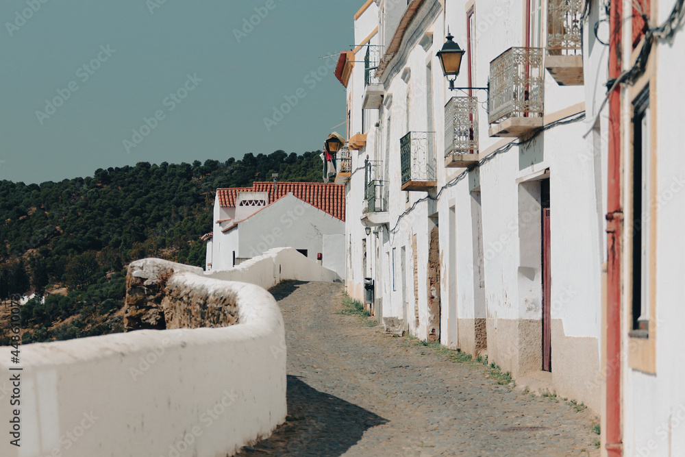 Typical narrow street in the ancient town of Mertola, Alentejo Region, Portugal.