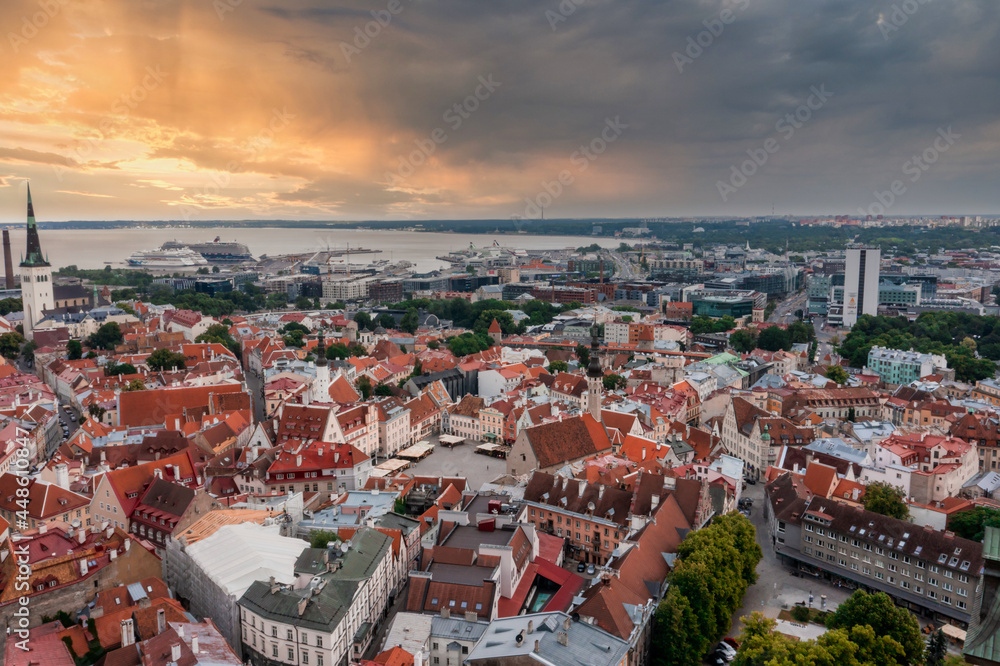 Medieval Tallinn, aerial view on the bright roofs of the old city with a drone, the main square of the city.