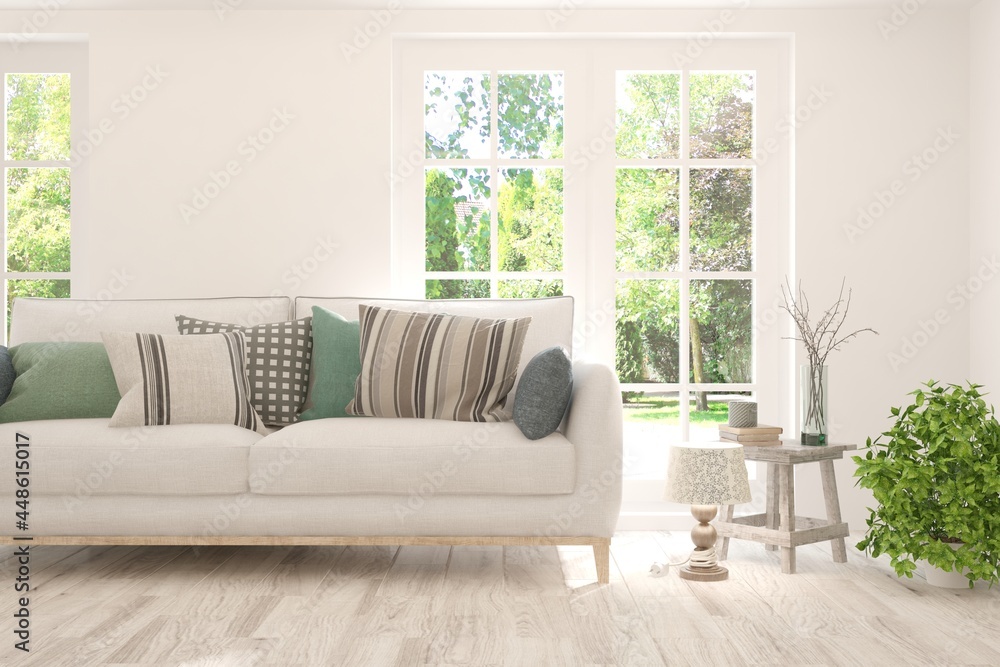 Fototapeta premium Stylish room in white color with sofa and summer landscape in window. Scandinavian interior design. 3D illustration