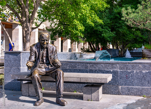 Photography Bronze statue of a man feeding pigeons in Craiova, Romania