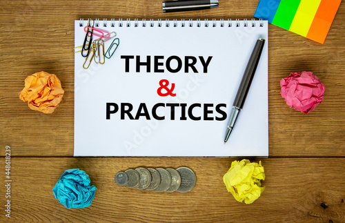 Theory and practice symbol. Words 'Theory and practice' on white note. Wooden table, colored paper, paper clips, pen, coins. Business, theory and practice concept. Copy space.