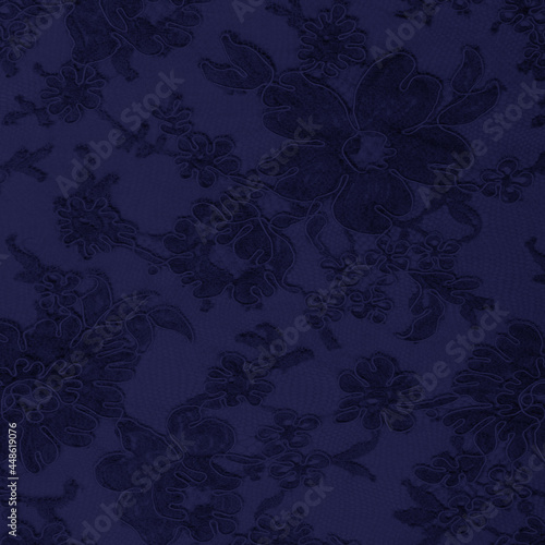 Navy blue lace fabric with a floral ornament. A feminine background best for invitations. 