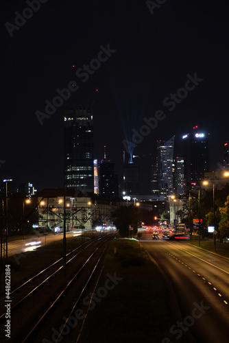 view of the center of warsaw at night, light show, completion of the construction of the skysawa skyscraper