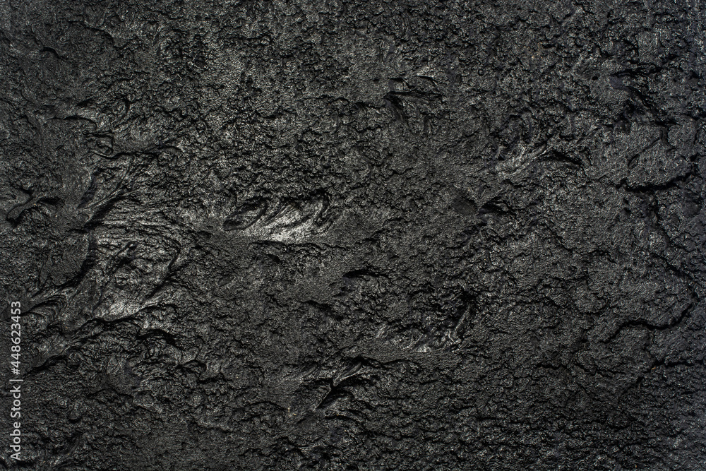 Background of an old black concrete wall. Background of an old black concrete wall.