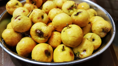 Fresh and ripe yellow hawthorn berries in metal plate