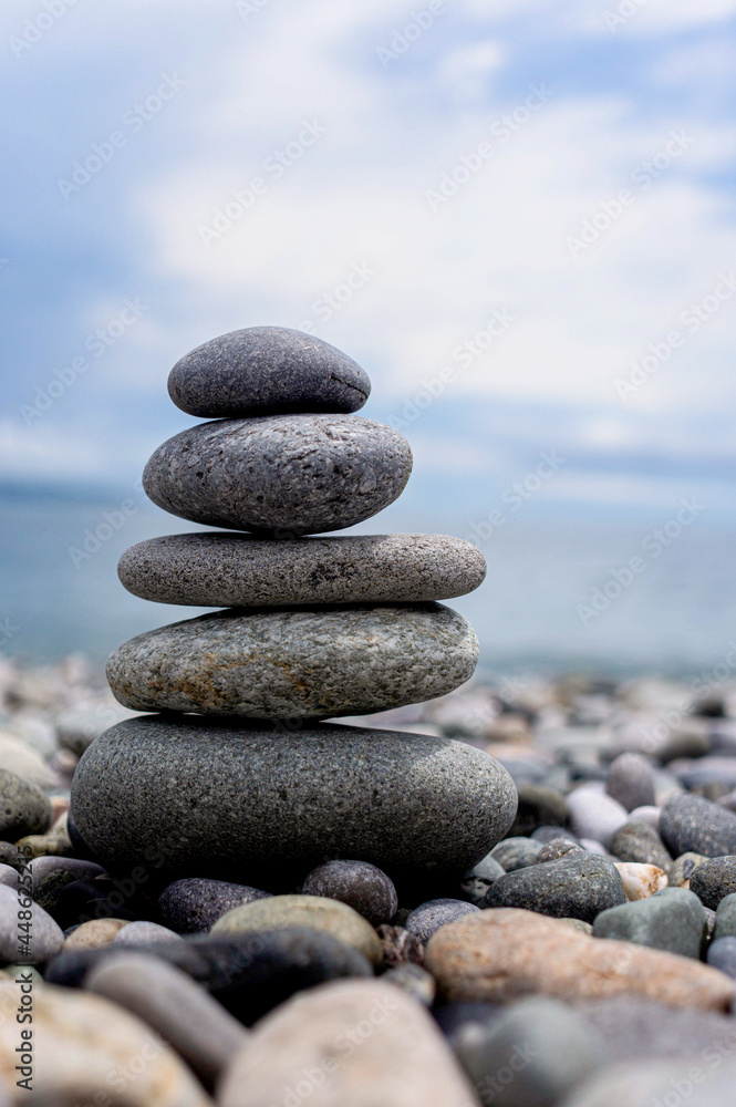 stack of zen stones on pebble beach stack of zen stones on pebble beach