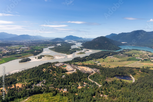 Aerial View of Fraser Valley with Canadian Nature Mountain Landscape Background. Harrison Mills near Chilliwack  British Columbia  Canada.