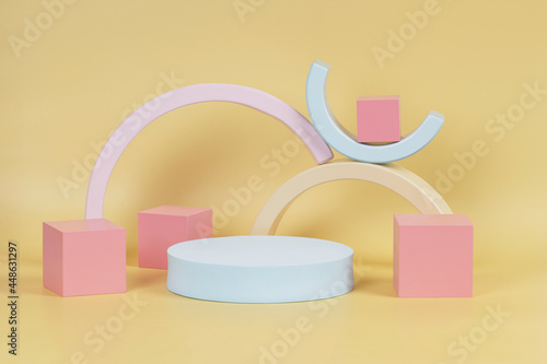 Abstract composition with geometric shapes forms. Podium, platform for product presentation on pastel yellow background © vejaa
