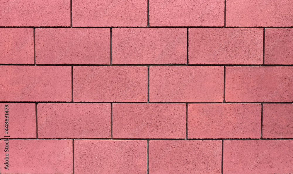 Fototapeta premium Wall of concrete blocks in pink, background
