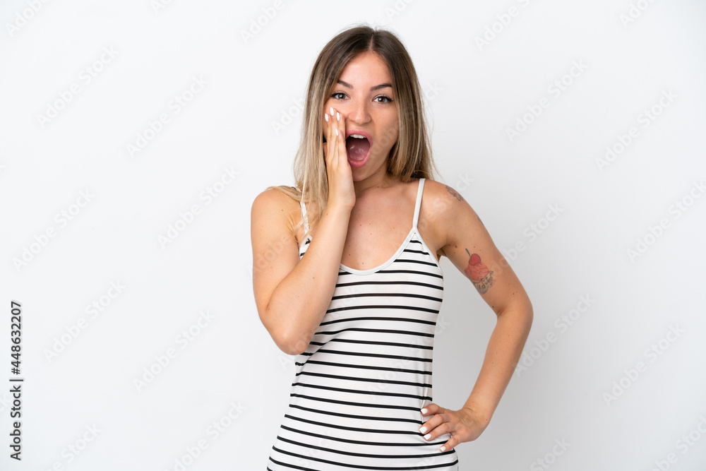 Young Romanian woman isolated on white background with surprise and shocked facial expression