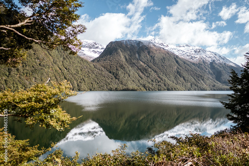 Reflections at Lake Gunn - scenic stopover on the road to Milford Sound in Fiordland National Park, New Zealand, South Island. photo