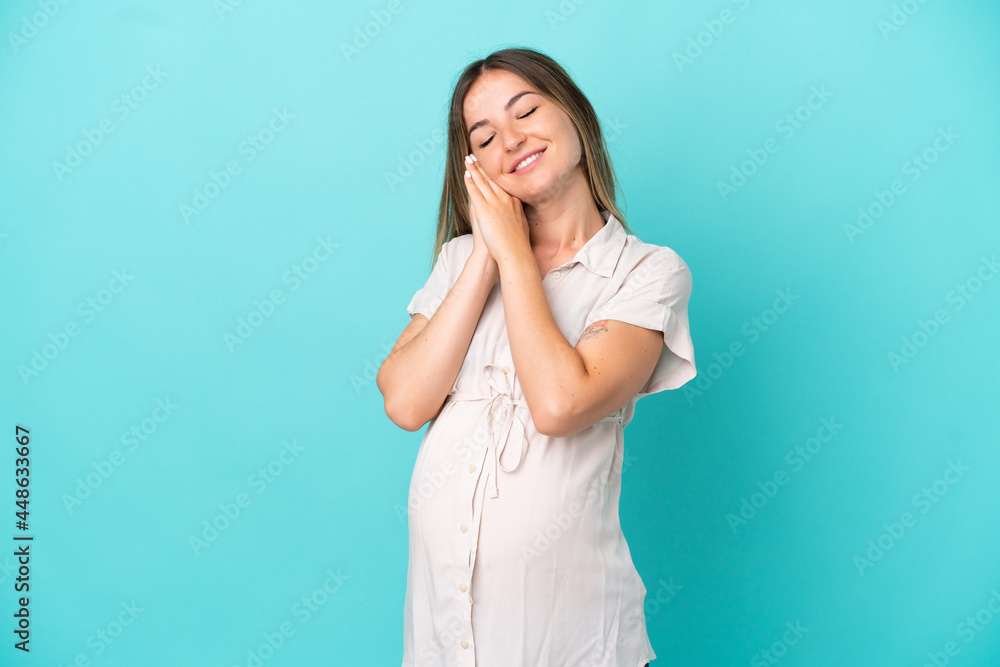 Young Romanian woman isolated on blue background pregnant and happy Young Romanian woman isolated on blue background pregnant and happy