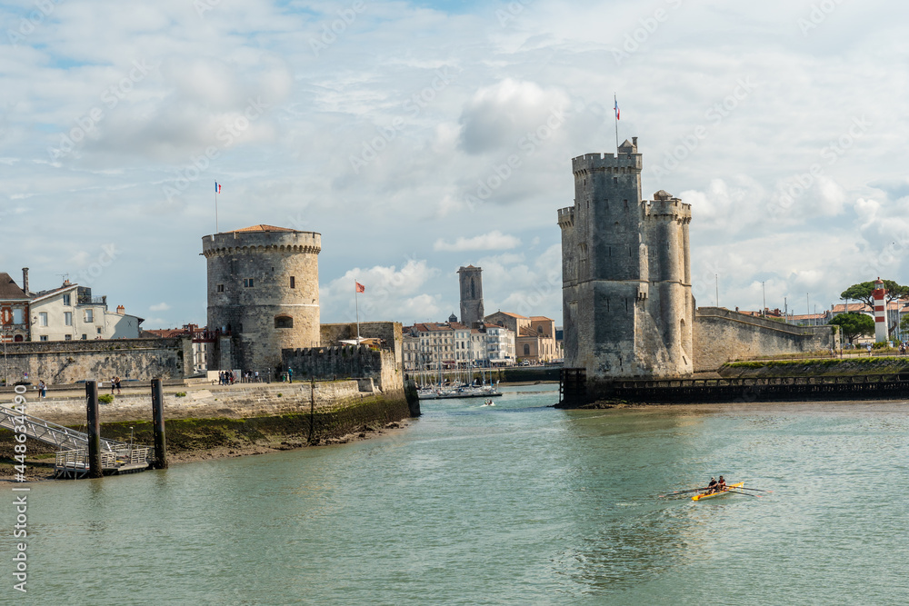 The beautiful entrance with the towers of the fort in La Rochelle. Coastal town in southwestern France