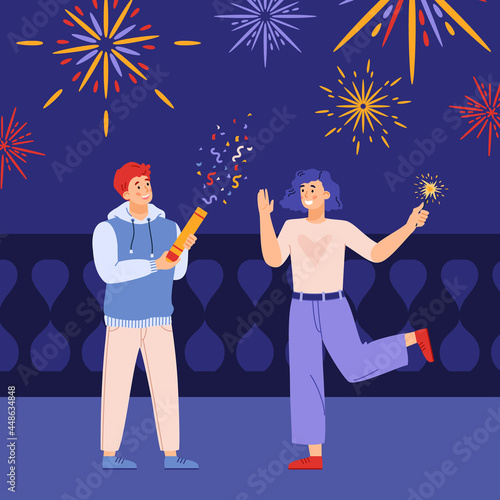 People with festive firecracker and sparkler in hands having fun on night street