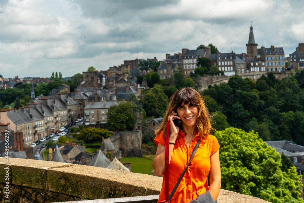 A young tourist girl visiting Fougeres castle in the covid-19 pandemic. Brittany region, Ille et Vilaine department, France