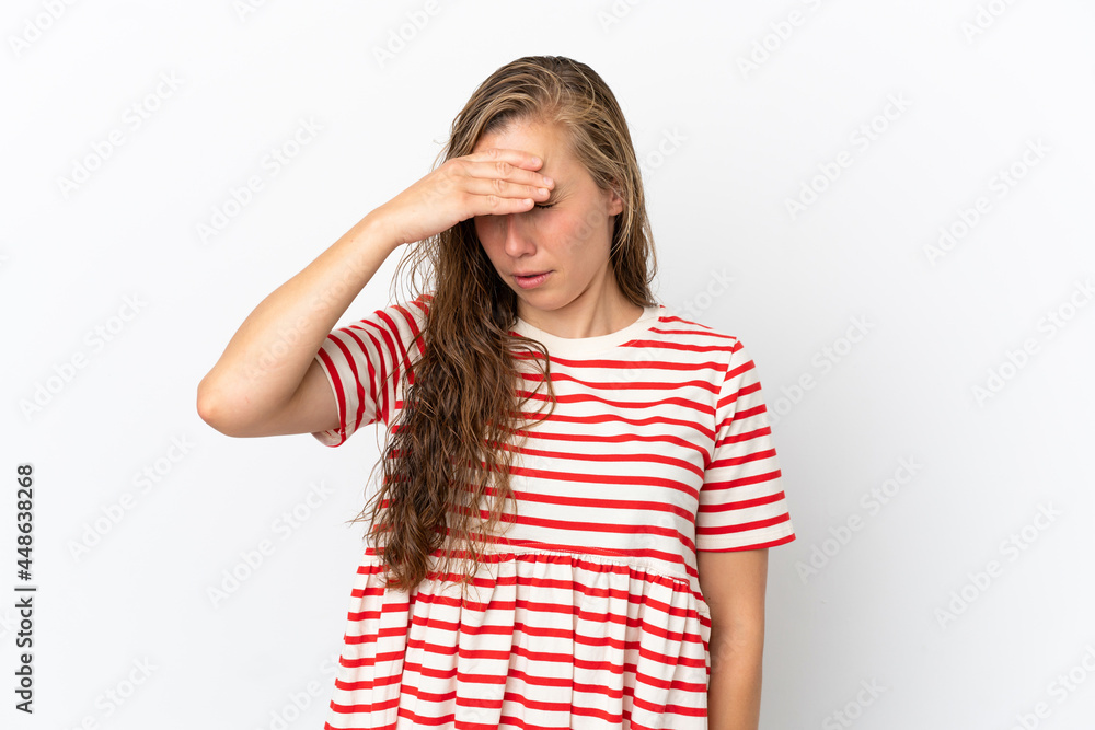 Young caucasian woman isolated on white background with headache