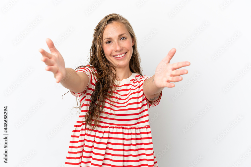 Young caucasian woman isolated on white background presenting and inviting to come with hand Young caucasian woman isolated on white background presenting and inviting to come with hand