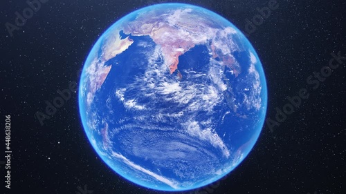 Blue planet earth rotating on starry night space background. 3d globe representing the world map. Frontal view. Concept of globalization, environment, climate change, communication, internet,business photo