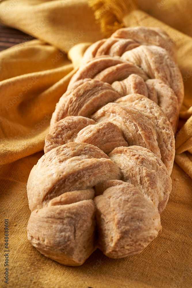 braided homemade bread on tablecloth braided homemade bread on tablecloth