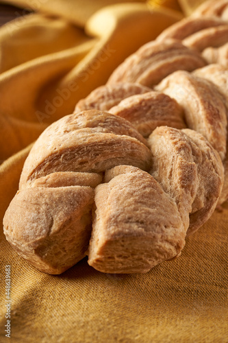 braided homemade bread on tablecloth