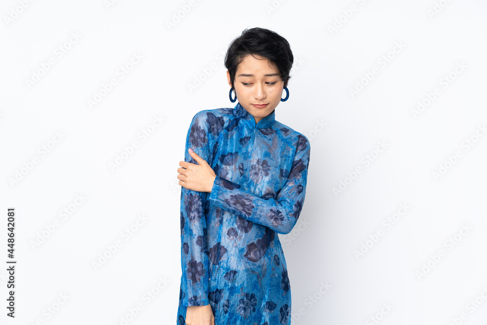 Young Vietnamese woman with short hair wearing a traditional dress over isolated white background laughing Young Vietnamese woman with short hair wearing a traditional dress over isolated white background laughing