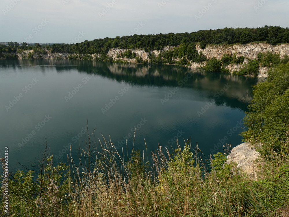 Scenic view on emerald waters of Zakrzówek Reservoir, Kraków, Poland Scenic view on emerald waters of Zakrzówek Reservoir, Kraków, Poland