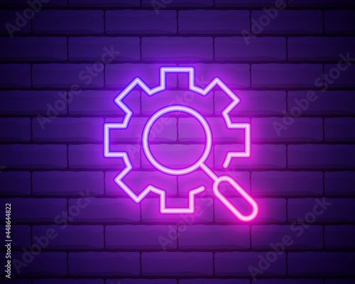 Fototapeta Naklejka Na Ścianę i Meble -  Glowing neon Magnifying glass and gear icon isolated on brick wall background. Search gear tool. Business analysis symbol. Vector Illustration