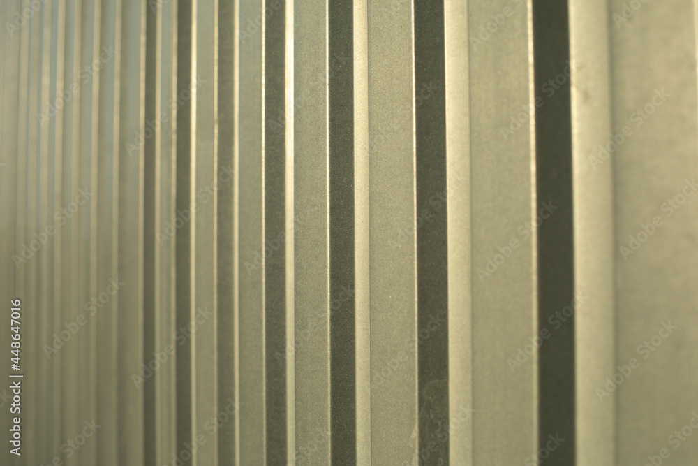Obraz premium The texture of the metal fence. Stainless steel in sunlight.