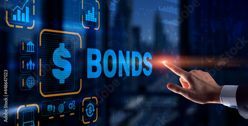 Businessman clicks a bonds virtual screen. Bond Finance Banking Technology concept. Trade Market Network photo