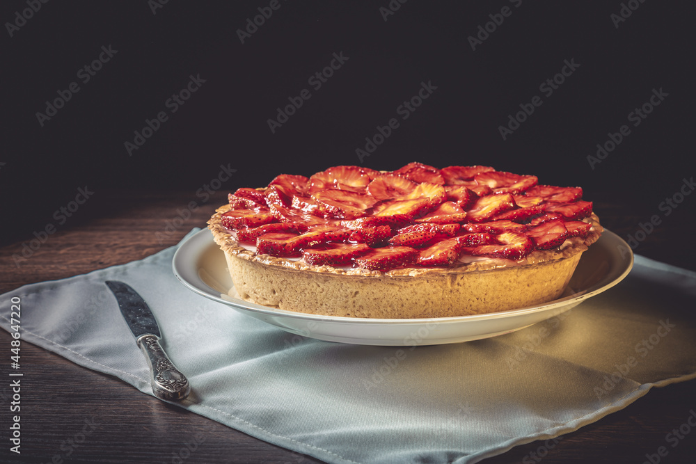 Homemade strawberry pie with syrup on a ceramic platter. Homemade strawberry pie with syrup on a ceramic platter.