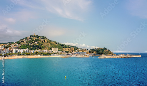 Tourists enjoy at the beach in Blanes in Costa Brava in a beautiful summer day  Spain