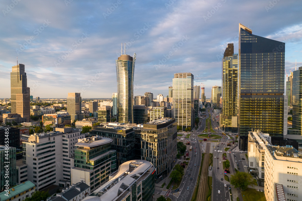 Warsaw at sunset. The capital of Poland is illuminated by a beautiful orange sun.