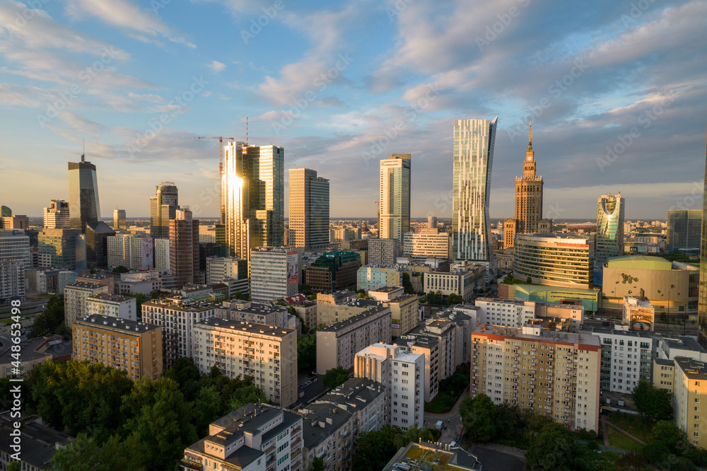 Warsaw at sunset. The capital of Poland is illuminated by a beautiful orange sun.