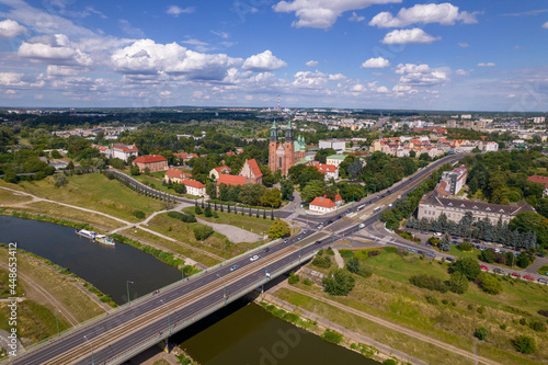 Poznan, Polish city during the day. The sun, the old town, the streets of Poznań, the Warta River and bridges over the river.