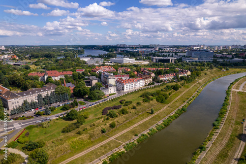 Poznan, Polish city during the day. The sun, the old town, the streets of Poznań, the Warta River and bridges over the river. © Olivier Uchmanski