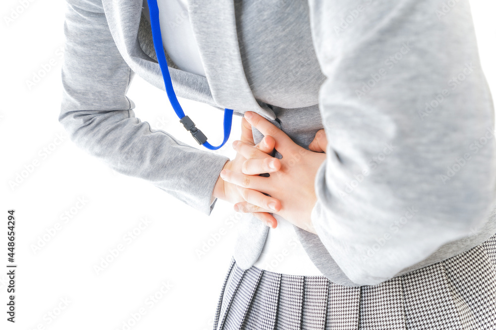 腹痛で苦しむ若いキャリアウーマン 腹痛で苦しむ若いキャリアウーマン