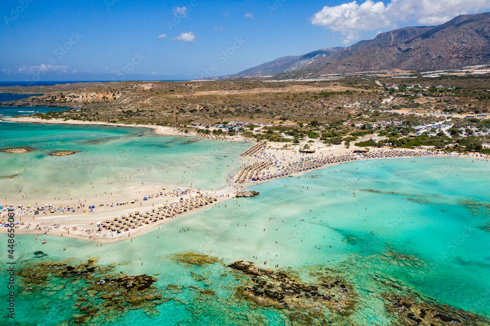 Aerial view of a beautiful narrow sandy beach and shallow, warm lagoons (Elafonissi Beach, Crete)