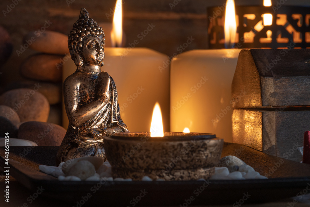 Fototapeta premium buddha statue with candles for meditation