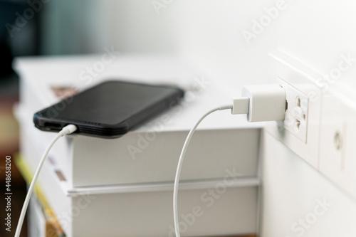 smart phone charger with plugged at home photo