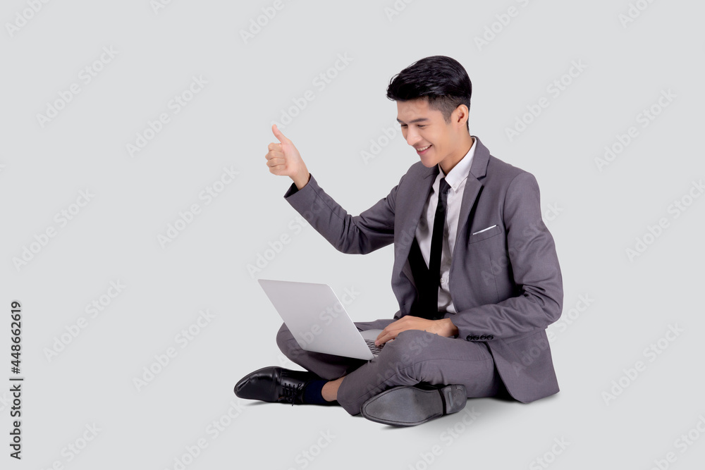 Young asian business man sitting work on laptop computer to internet online isolated on white background, businessman confident and notebook, freelance with success, marketing and communication. Young asian business man sitting work on laptop computer to internet online isolated on white background, businessman confident and notebook, freelance with success, marketing and communication.