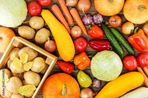 Harvest. Autumn vegetables on a wooden background. Organic food. Top view.