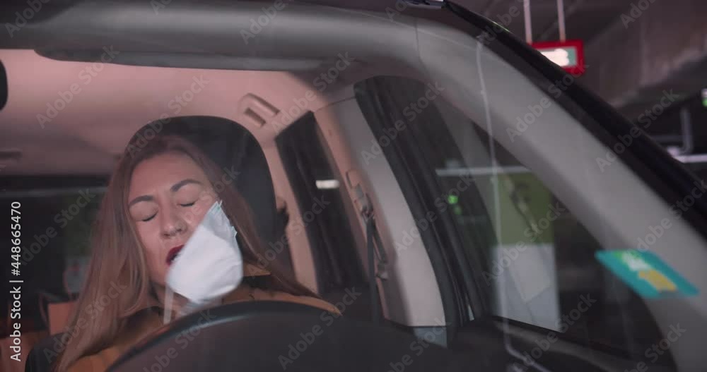 Life during quarantine. Beautiful stressed tired young blonde woman opens car door, gets inside and takes face mask off. Life during quarantine. Beautiful stressed tired young blonde woman opens car door, gets inside and takes face mask off.