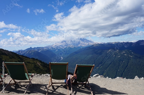 Empty chairs overlooking mountains