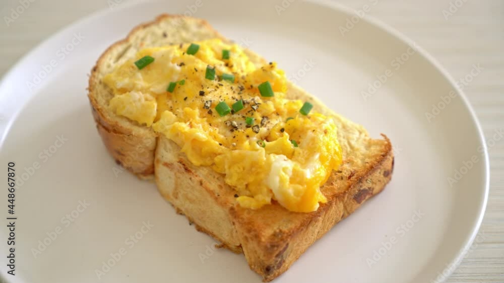 bread toast with scramble egg on white plate bread toast with scramble egg on white plate
