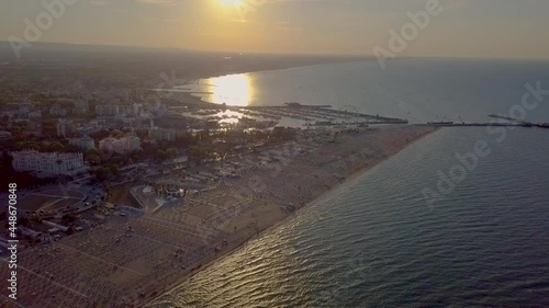 Aerial View of the Beach between Rimini and Riccione in Emilia Romagna At Sunset In Italy - drone shot photo
