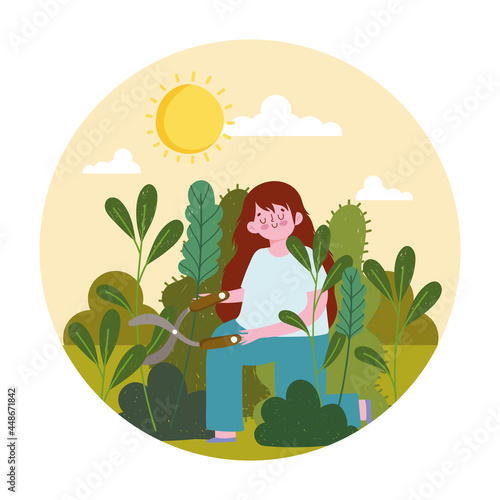 girl trimming bushes