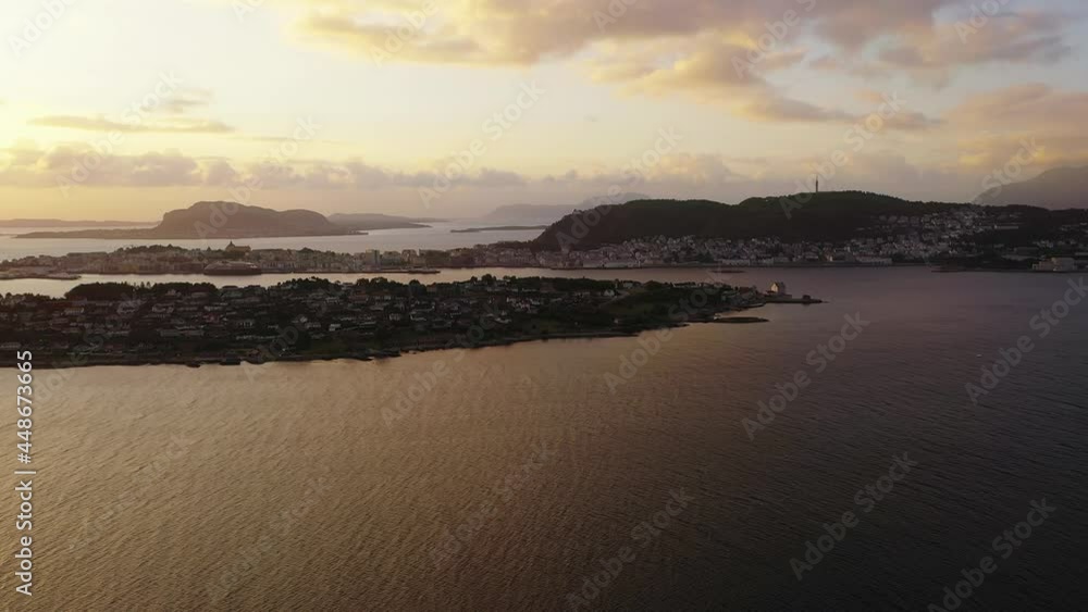 Aerial view of the Alesund city, colorful sunset in Norway - tracking, drone shot Aerial view of the Alesund city, colorful sunset in Norway - tracking, drone shot